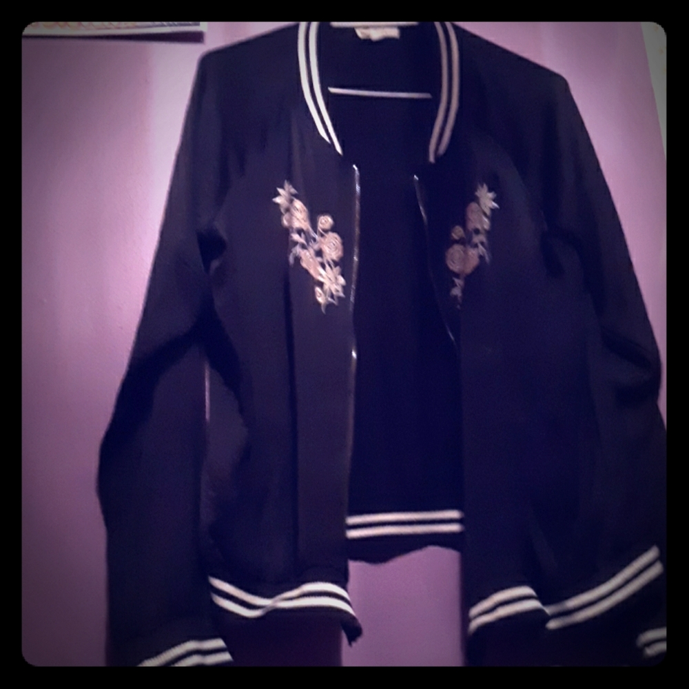 Jacket with flowers and black and white stripes.